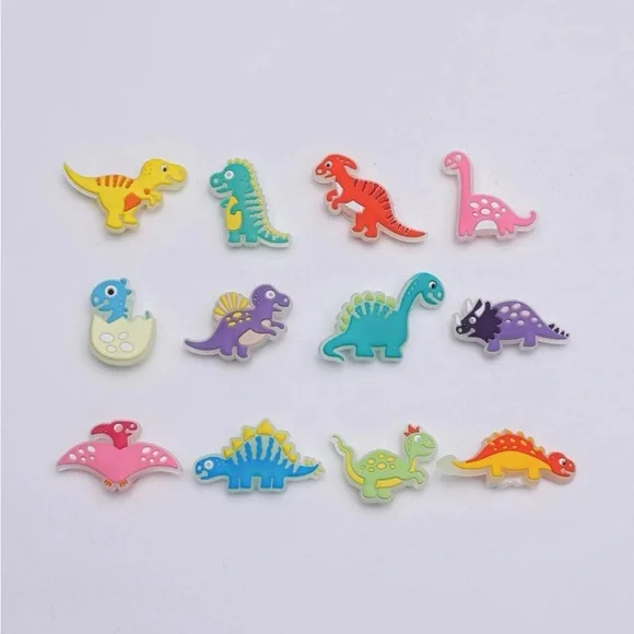 CROCS || 12pcs DINOSAUR SHOE CHARMS GLOW IN THE DARK || NWT ✨ - Picture 2 of 2